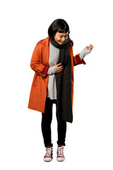 A full-length shot of a Short hair woman with coat smiling a lot over isolated white background