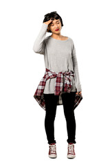 A full-length shot of a Young woman with short hair with tired and sick expression over isolated white background