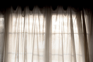 Sheer fabric window curtain with filtered light