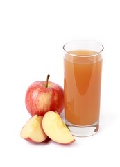 apple juice - sliced ​red apples and a glass of naturally cloudy apple juice in front of white background