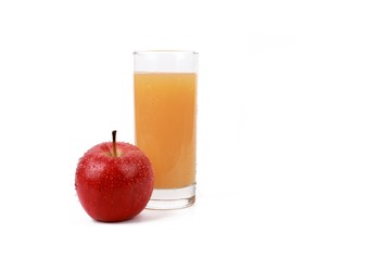 apple juice -  ​red apple with drops of water and a glass of naturally cloudy apple juice in front of white background