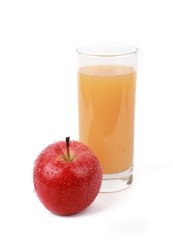apple juice -  ​red apple with drops of water and a glass of naturally cloudy apple juice in front of white background