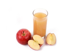 apple juice - sliced ​red apples and a glass of naturally cloudy apple juice in front of white background