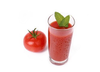 Tasty tomato juice and tomato's - glass with fresh tomato juice and a fresh tomato with drops of water isolated on white