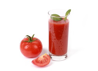 fresh tomato juice - glass with fresh tomato juice and a fresh tomato with drops of water isolated on white
