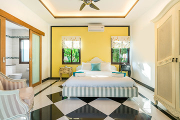 Luxury real Interior design in bedroom of pool villa with cozy king bed. with high raised ceiling  home, house ,building