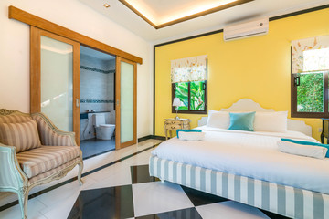 Luxury real Interior design in bedroom of pool villa with cozy king bed. with high raised ceiling  home, house ,building