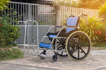Fototapeta na wymiar Empty wheelchair for patient or senior or elderly people at the front house,healthy medical concept