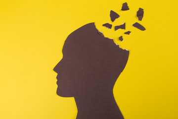 Brain disorder symbol presented by human head made form paper . Creative idea for Alzheimer's...