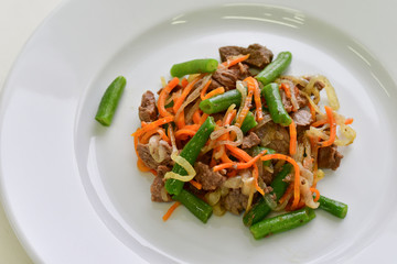 warm salad of beef, green beans and vegetables in the Italian restaurant. the concept of healthy eating, diet