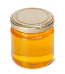 Glass jar full of sweet honey isolated on white background