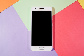 The smartphone on color background
