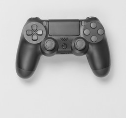 Gamepads on grayl paper background. Top view. Minimalism.
