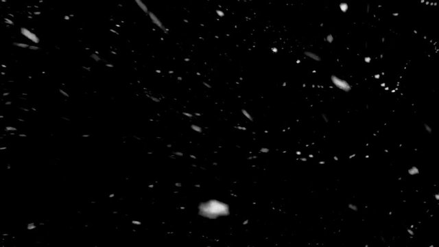 Snowstorm at night. Abstract moving particles.