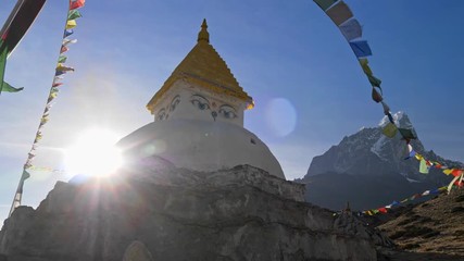 Himalaya, Nepal. A stupa on the track to the Everest Base Camp shining in the sun rays. UHD 4K