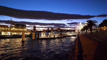 Ferry coming to Luna Park in Milsons Point, Sydney, at night