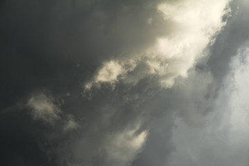 Naklejka na ściany i meble Background of storm clouds before rain thunder. Dramatic dark sky and bad weather