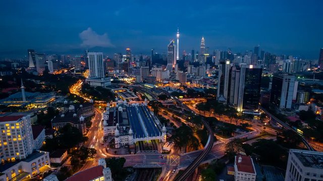 Kuala Lumpur, Malaysia - December 9, 2015: 4K Cinematic Zoom Out Time Lapse Footage of Kuala Lumpur city skyline taken from TNB 2 Building near KL Sentral.