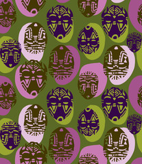 Seamless ethnic pattern with African masks. African tribal ornament.Design for fabric print, wallpaper background.
