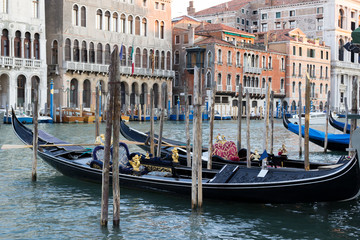 Fototapeta na wymiar Venetian gondolas on venetian canal