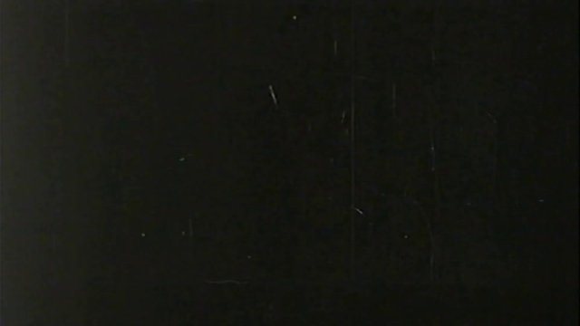 A retro Old Film Look overlay with dirt, light leaks, grainy texture, vintage black screen