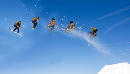 Snowboarding Snowboard Snowboarder at jump mountains at sunny day
