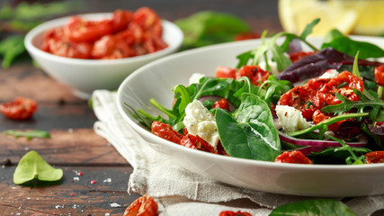 Sun dried tomatoes Salad with fresh vegetables mix and mozzarella cheese. healthy food. closeu up - obrazy, fototapety, plakaty