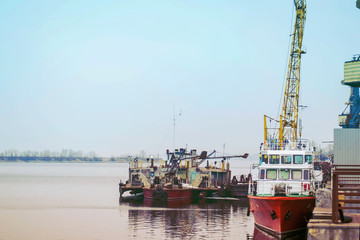 Cargo dock ship-lifting cranes in the harbor, Cargo river port terminal container