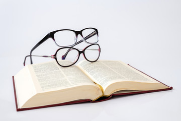 Two glasses for women with monofocal lenses and book