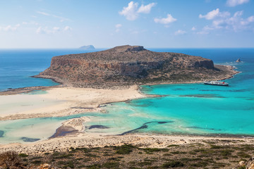 Crete coast, Balos bay, Greece. Amazing sand strand, sea of turquoise and blue colors with the ship. Popular touristic resort. A landscape on a summer sunny day.