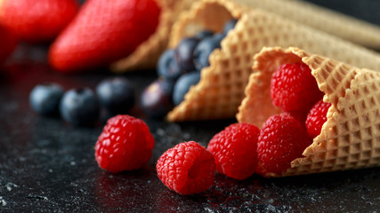 Fresh Blueberries, Raspberries, strawberries in waffle cones.