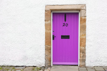 Obraz na płótnie Canvas Purple old wooden door rustic ancient house entrance in Culross