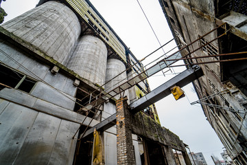 Old industrial building for demolition. Abandoned building exterior.