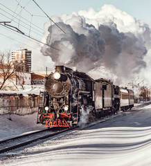 Steam train moves toward.