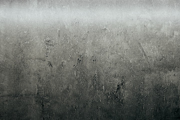 Grey grunge textured wall. Copy space cracked stone