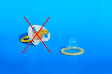 Stripped nipple with a condom, the concept of healthy sex, birth - against, contraception - for.