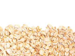 raw oatmeal on white background with copy space. Isolated one edge. Top view or flat lay.