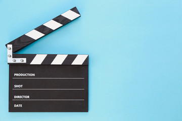 Obraz premium black clapperboard with free space for text isolated on color background