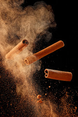 Food explosion with cinnamon sticks and powder