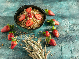 Baked muesli and fresh strawberries. Homemade Granola. Delicious and healthy breakfast. Selective focus
