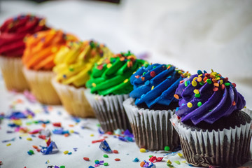 Rainbow cupcakes in a row