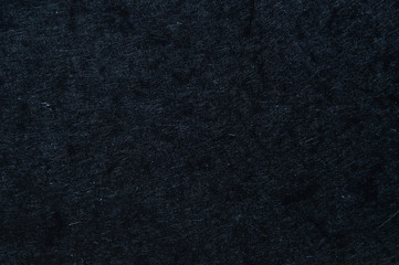 The surface texture of the fibrous cardboard is brown.