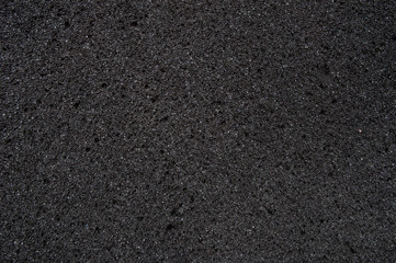 The texture of the foam surface is dark gray.