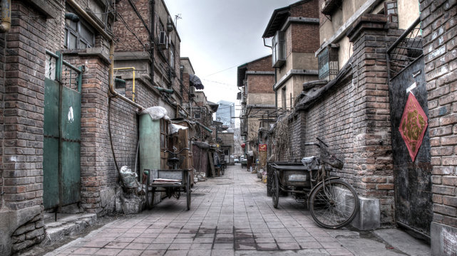 Hutong Alley In China With Bikes, Doors And Other Industrial Things