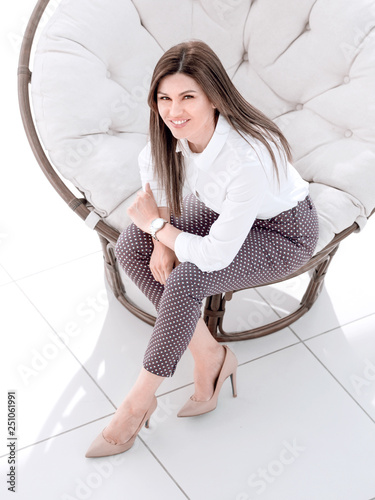 Top View Young Woman Sitting In Soft Round Chair Stock