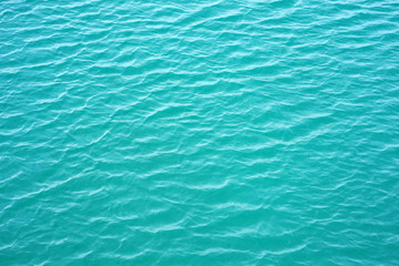 Blue rippled water as abstract background. Tranquil surface texture of the sea. Water ripples of a lake. Blue sea water in calm.
