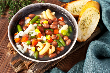  Ceramic bowl of minestrone soup with  toasts