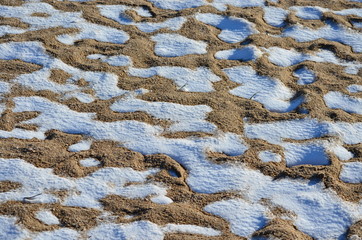 Snow on sand.