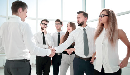 business team looking for a handshake of business partner