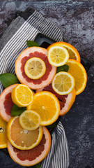 Colorful assortment of  citrus fruits. Dark background